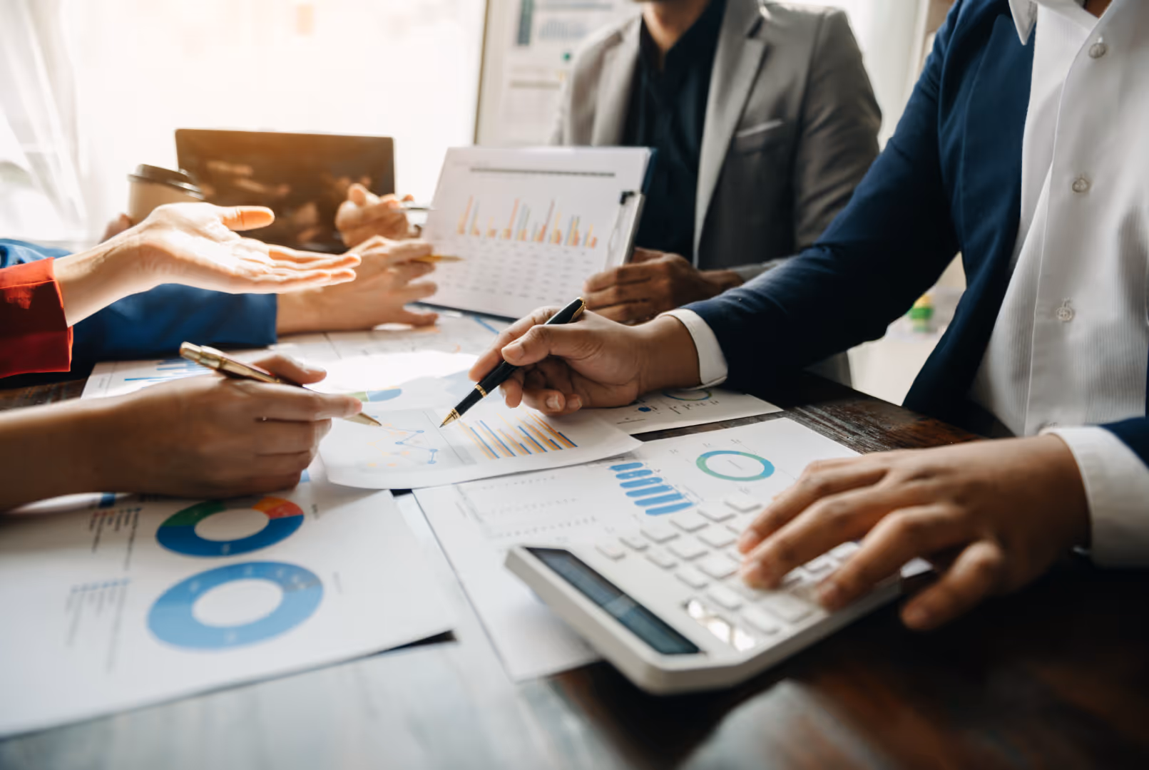 Small business team reviewing financial reports together